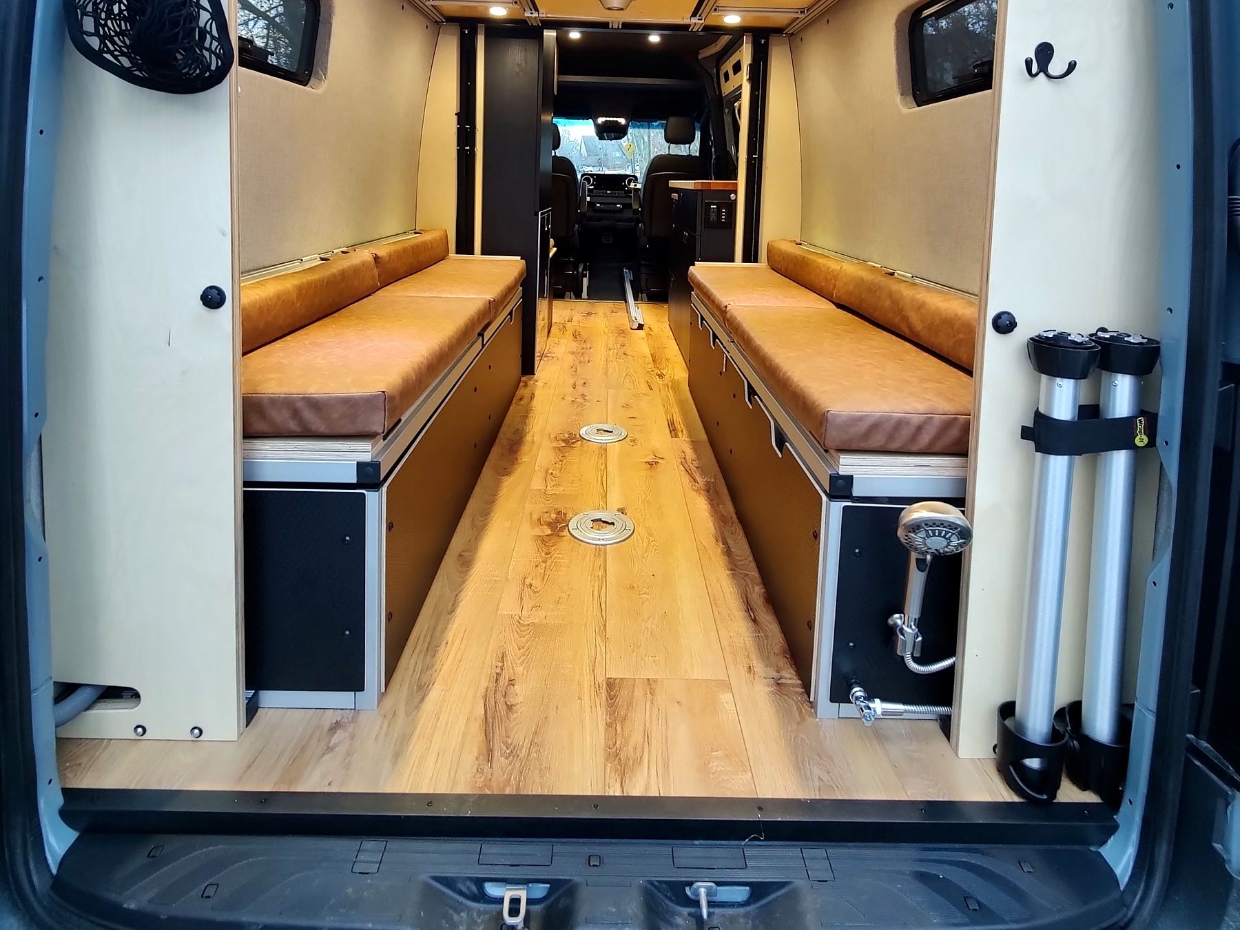 Wood-look plank floor between bench seats