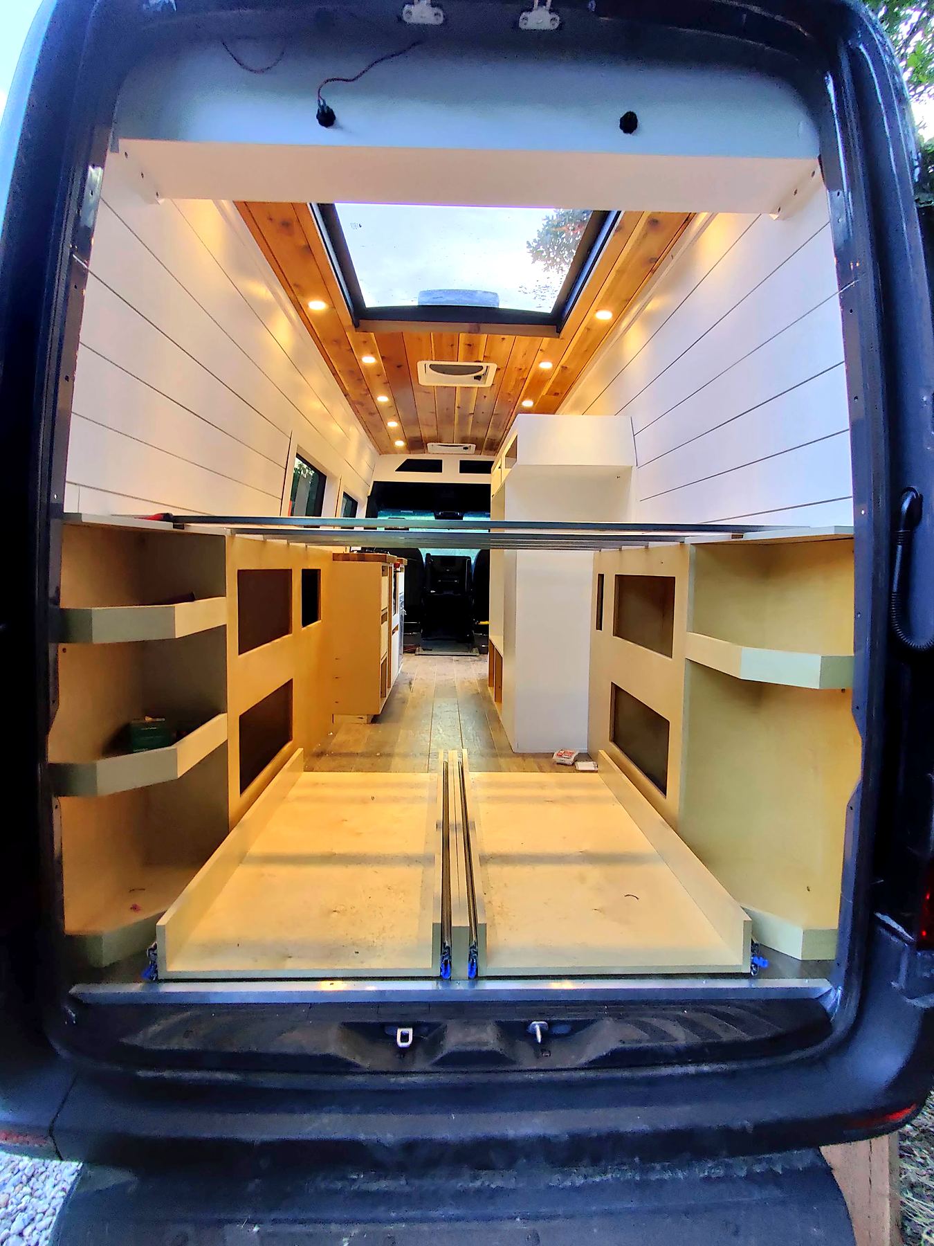 Van ceiling with skylight fan and recessed lights