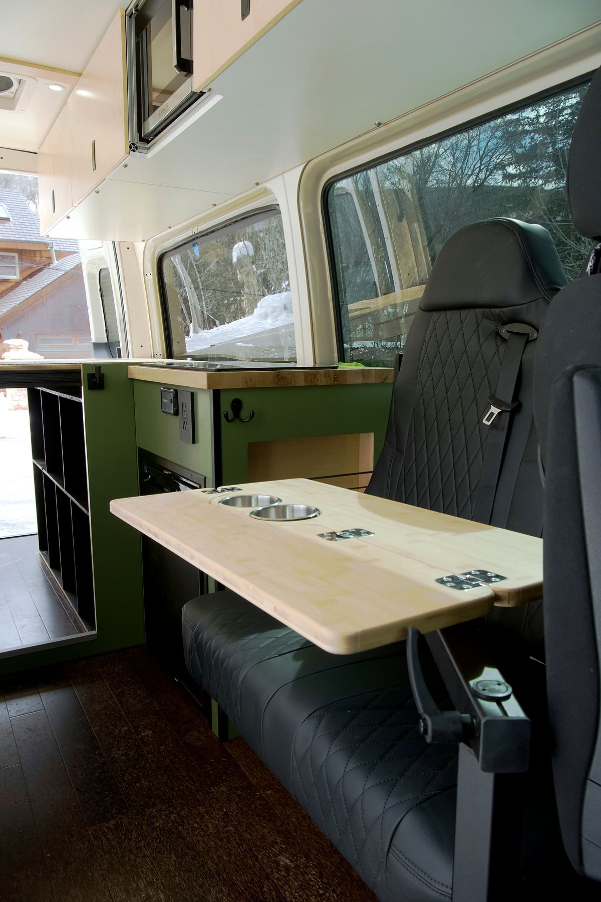 Quilted passenger bench with a maple table and cup holders
