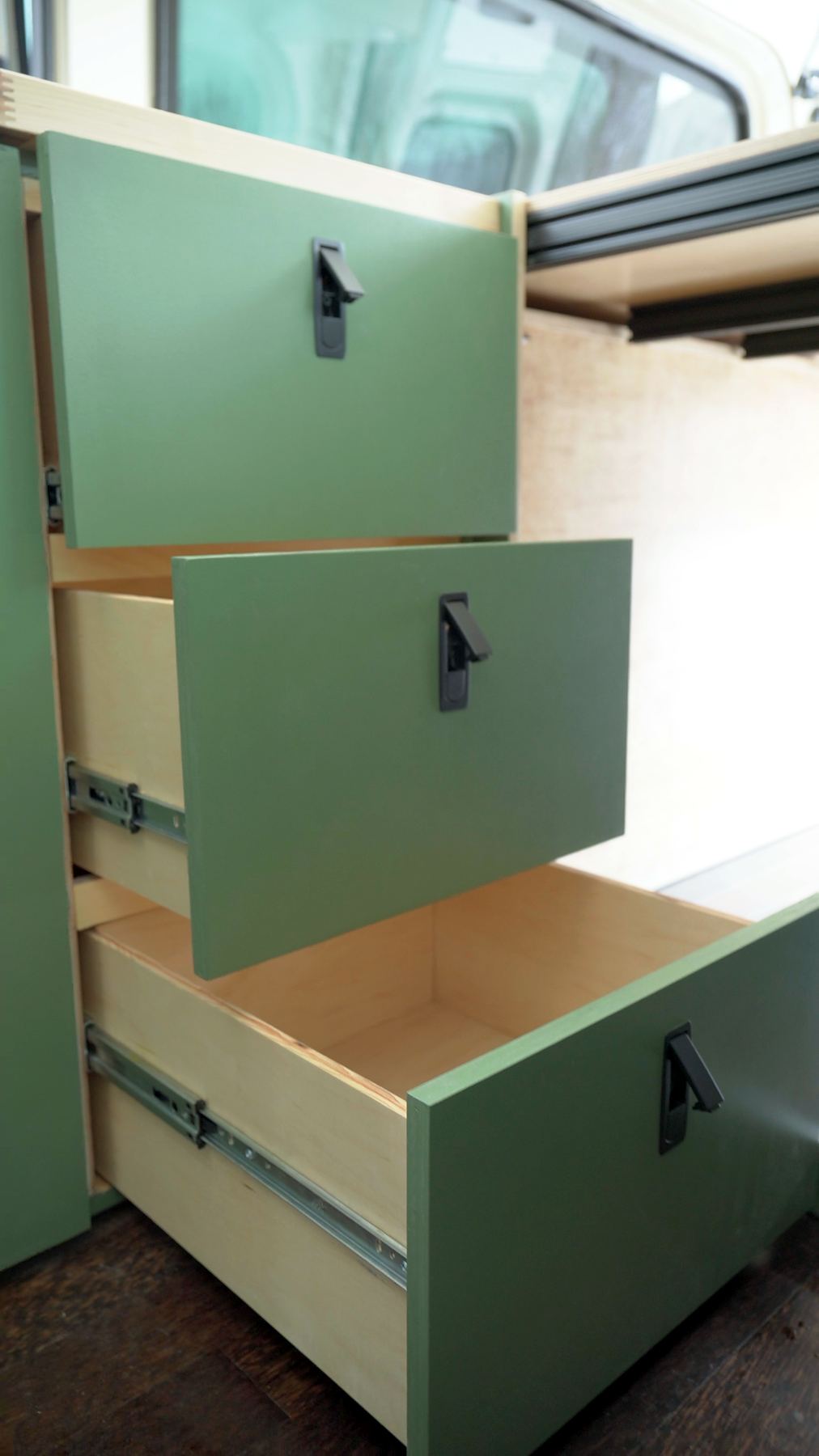 Sage green drawers on full-extension slides