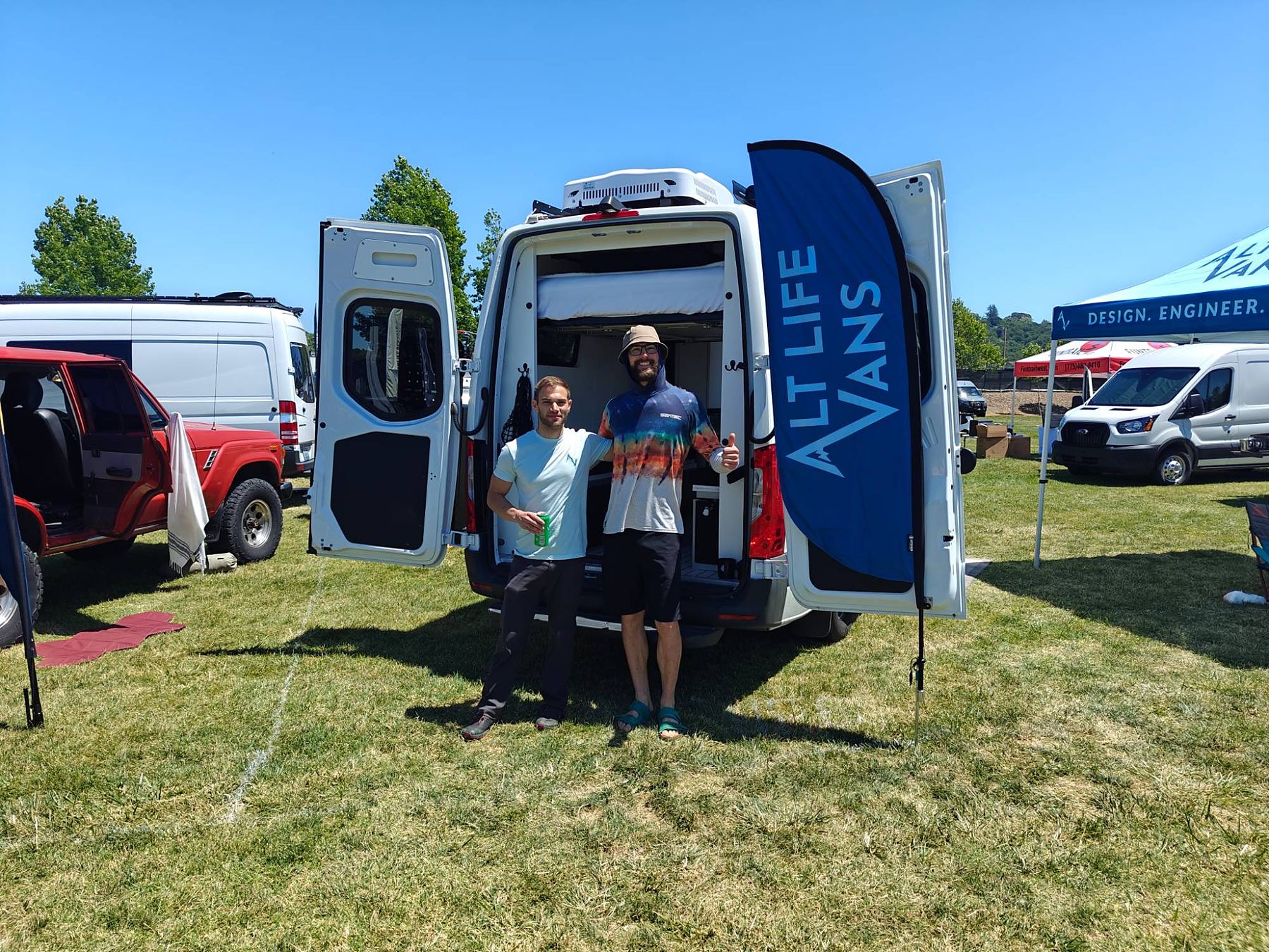 Greg and Brandon with an Alt Life Vans build at a van show